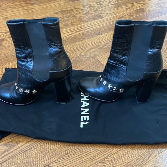Channel Leather boots with charms on the front of the boot. - Picture 2 of 3